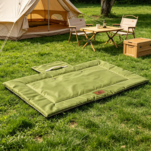Green foldable outdoor pet travel mat at a campsite
