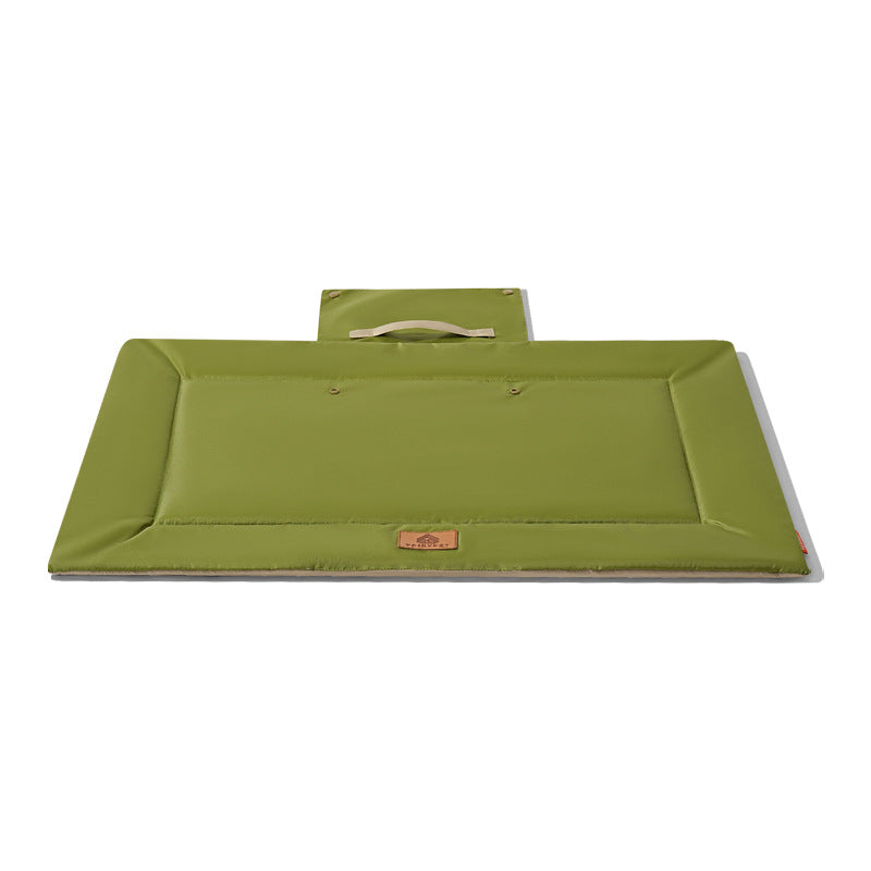 Green foldable waterproof outdoor pet travel mat on a white background